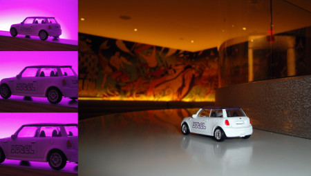 On the left you can see the Yotel toy car in my room. Yes, purple lights are part of the design. On the right is the car in the bar/restaurant . . . which has great artwork on the walls.